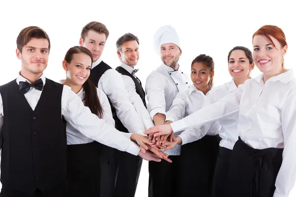 depositphotos_44069941-stock-photo-waiters-and-waitresses-stacking-hands Personalservice